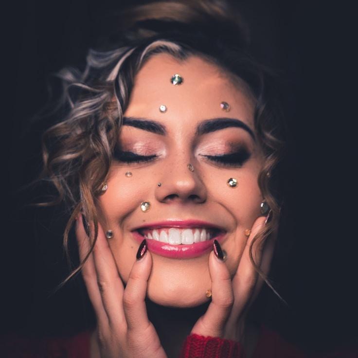 Ari Patel, Lead Design Curator at Aximorainte Gration, reviewing corporate floral arrangements